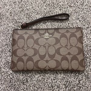 Mid size coach wristlet. Brand new!